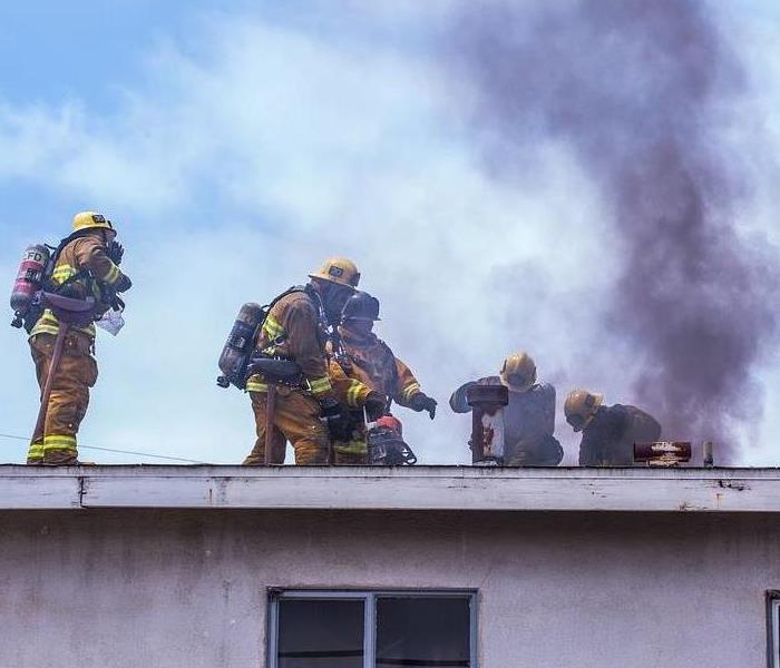 Firefighters at a house fire.