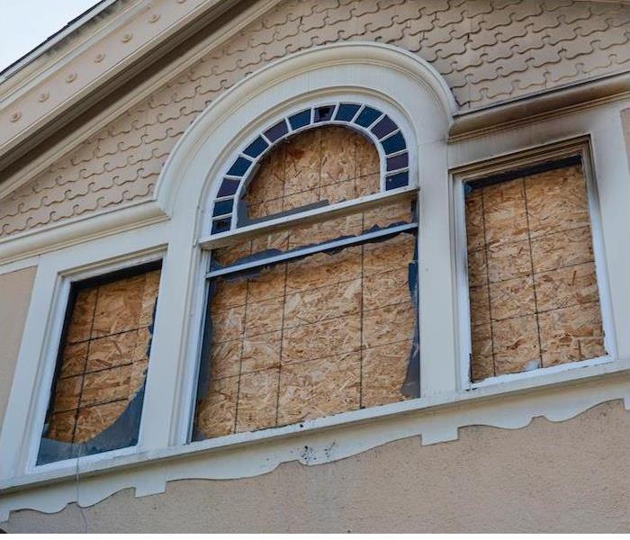 window boarded up in a house