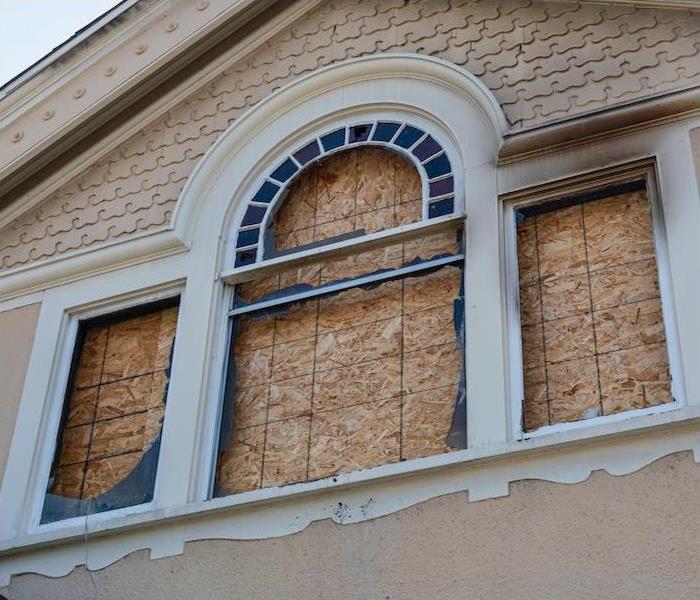 Boarded up window in a house