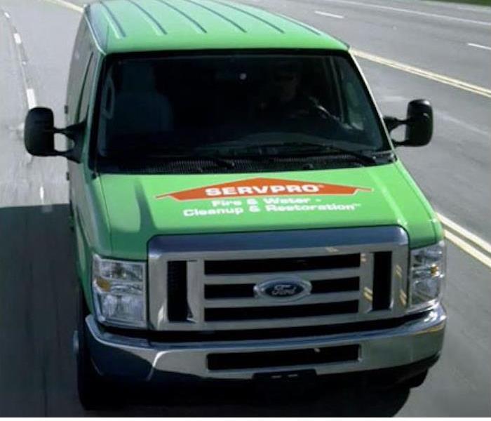 SERVPRO green truck driving down the highway