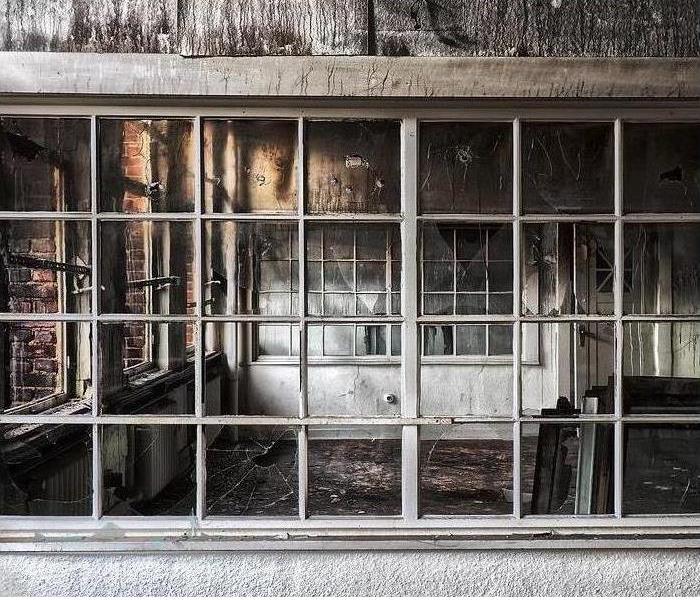 White room with fire damage.