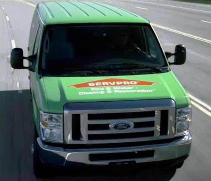 Front of green SERVPRO Truck with orange SERVPRO Logo.